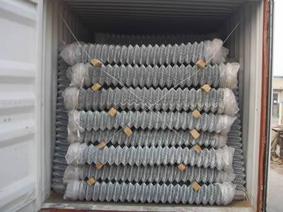 Galvanized chain link rolls are placed orderly in container, with two wooden sticks between two layers, it can prevent scratches or crush.