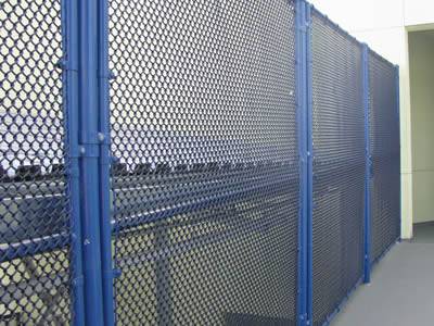 A blue mini chain link security fence is installed on the road to protect personal safety and property.