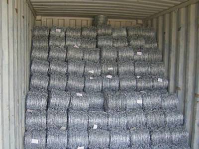 Several rolls of barbed wires are placed in the container tidily.
