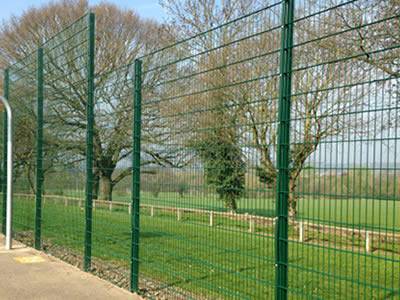 A green PVC coated welded double wire fence is installed at a basketball court.