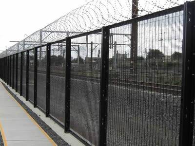 Combined with razor wire, a black PVC coated prison security fencing is installed at the railway station.