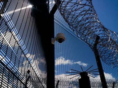 Concertina razor wire combined with welded wire mesh fence to achieve high level security.