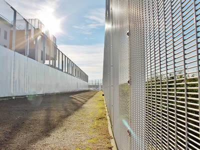 A galvanized prison security fencing of small mesh size is installed in prison.